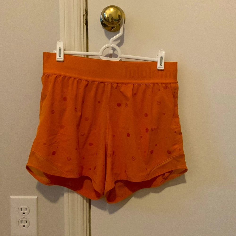Orange, mid/high rise LuLuLemon shorts, size 6/8